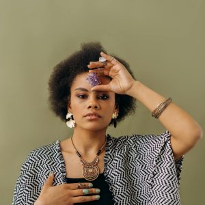 Woman in Black and White Sleeveless Top Wearing Silver Necklace