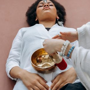 Woman in White Long Sleeve Shirt Holding White Ceramic Bowl With Food